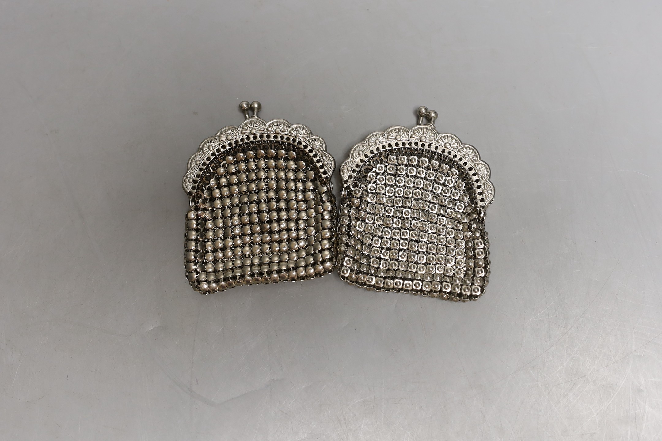 A chain mail metal evening bag and two similar purses.